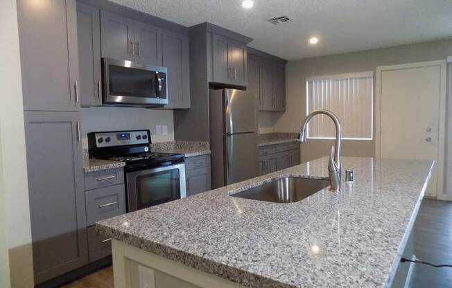 Full kitchen with counters and appliances Sacramento CA 95814 Apts For rent at The Palms 