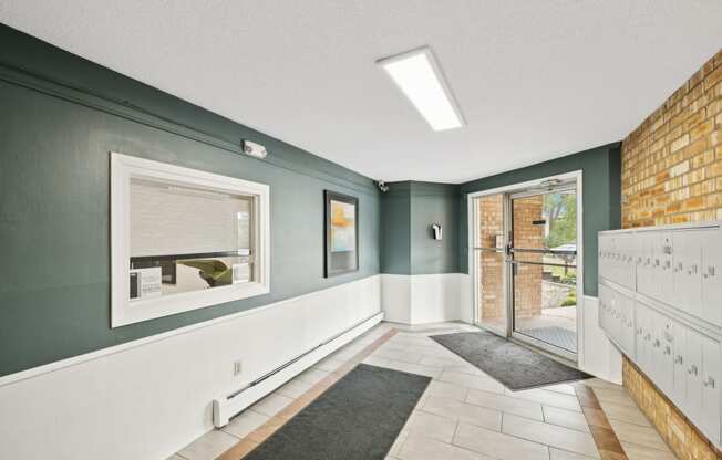 theoyer of a house with a brick wall and a glass door