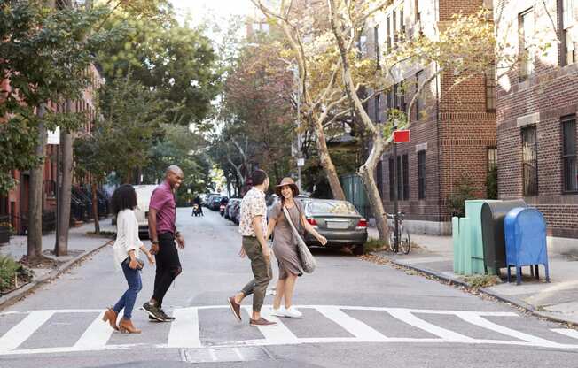 group-of-friends-crossing-urban-street-in-new-york-PSTBEL6-min at Fairmont Apartments, Washington, DC, 20009