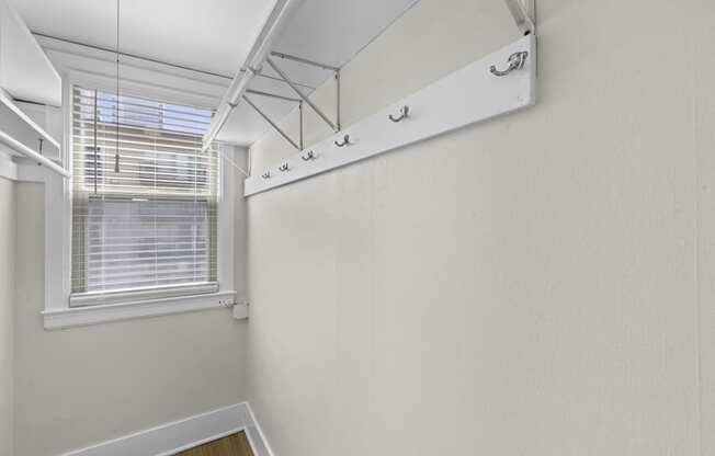 Expansive closet with a large window with built in shelving at Stockbridge Apartment Homes, Seattle, WA