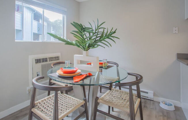 a dining room with a glass table and chairs at Sunnyvale Crossings Apartments, LLC, California, 94087