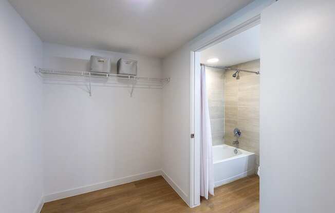 a bathroom with a shower and a bath tub in it