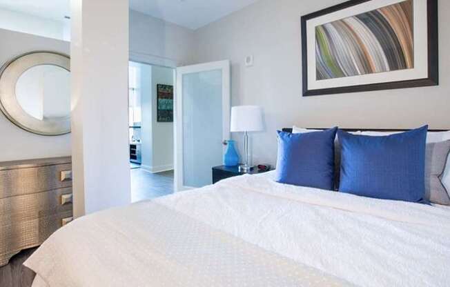 Large bedroom with high ceilings and hardwood style flooring at Philadelphia, PA Pepper Building community in Rittenhouse Square
