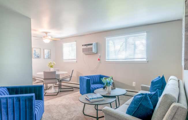 a living room with couches and chairs