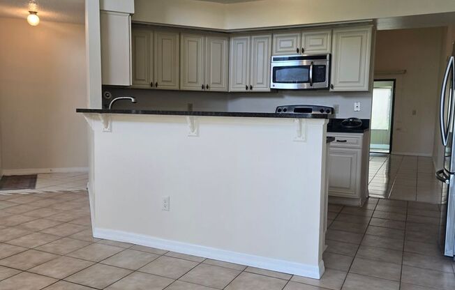 Beautiful 4 Bed / 2 Bath Single-Family Home with Fenced Yard & Screened Patio
