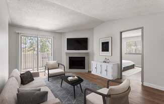 a living room with a couch and a chair and a fireplace at Verona, Colorado, 80123