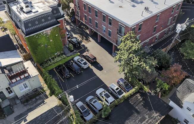 an aerial view of a city street with cars parked in a parking lot at The Granite Works Apartments , Buffalo, NY, 14202