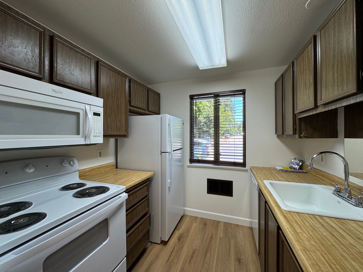 Charming Condo with Creek Views, Laminate Flooring, and Prime Location Near Washington Square!