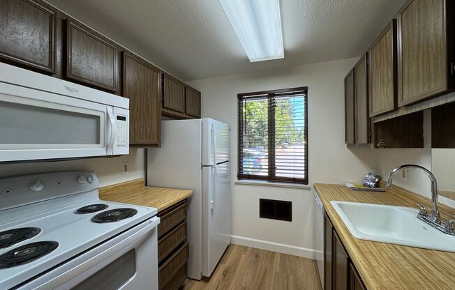 Charming Condo with Creek Views, Laminate Flooring, and Prime Location Near Washington Square!