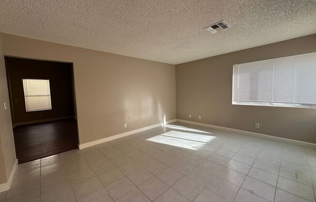 Newly renovated home with brand new kitchen and flooring downstairs! Home features a large living room with a fireplace and a separate family room! Brand new large kitchen cabinets and countertops! A large backyard! And is nearby the Summerlin Parkway hig