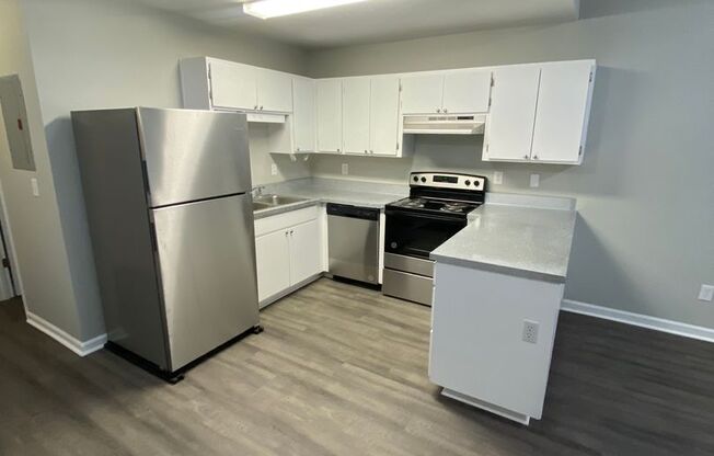 Freshly Remodeled 2 BR 2 BA Townhome Available Now! Beautiful New Flooring, Paint, And More!