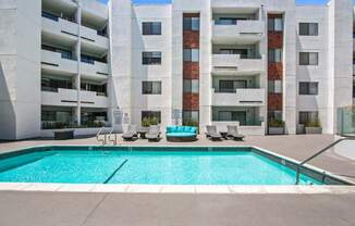 an image of a pool in front of an apartment building  at Masselin Park West, Los Angeles, CA