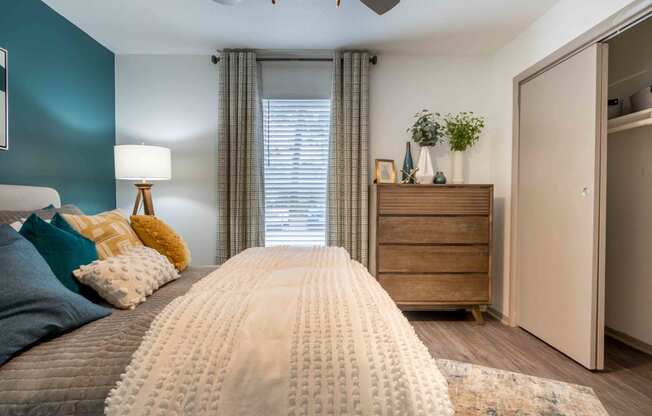 The Jaunt Apartments in Charleston South Carolina photo of bedroom with plush carpeting and a ceiling fan