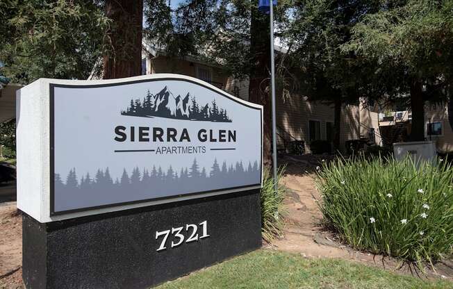 A sign for Sierra Glen Apartments is displayed in front of a building at Sierra Glen Apartments, California, 95621