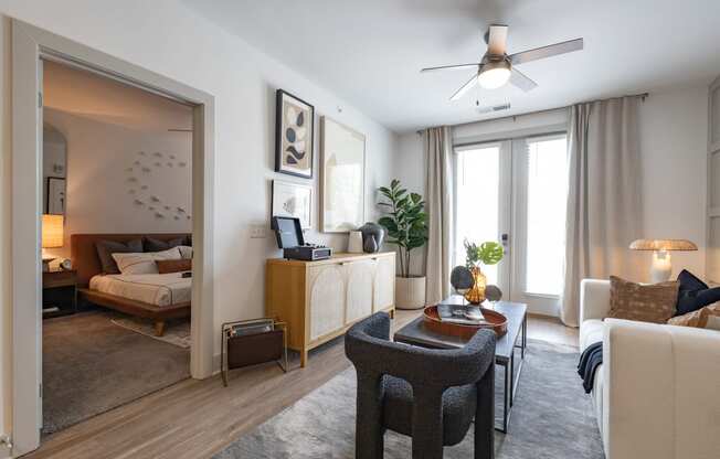 a living room and bedroom in a 555 waverly unit