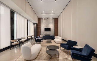 a lobby with couches and chairs and tables at The Paxton, Brooklyn, NY 11201