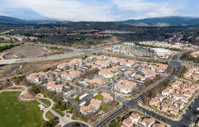 A bird's eye view of a residential area with houses and roads at Cornerstone at Gale Ranch Apartments, San Ramon