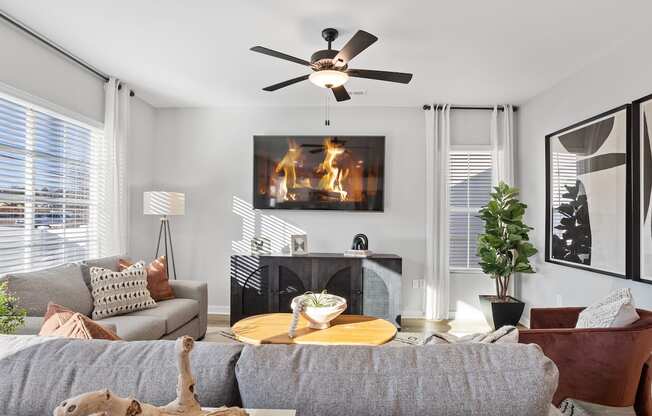 a nicely decorated living room with large windows and natural light in a rental home at Sanctuary at Indian Creek