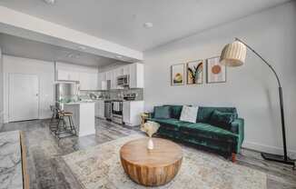 Living Room with white walls and hardwood flooring.