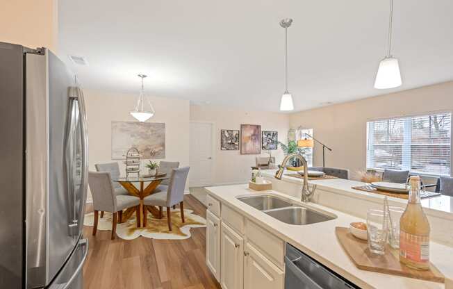 a kitchen and dining area in a 555 waverly unit