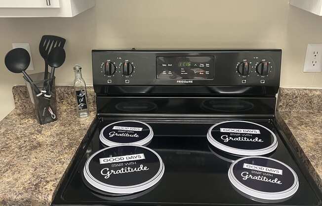 a black refrigerator freezer sitting on top of a kitchen counter