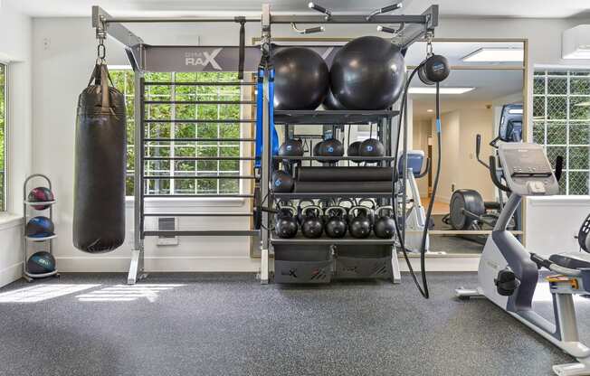 a gym with a punching bag and fitness equipment