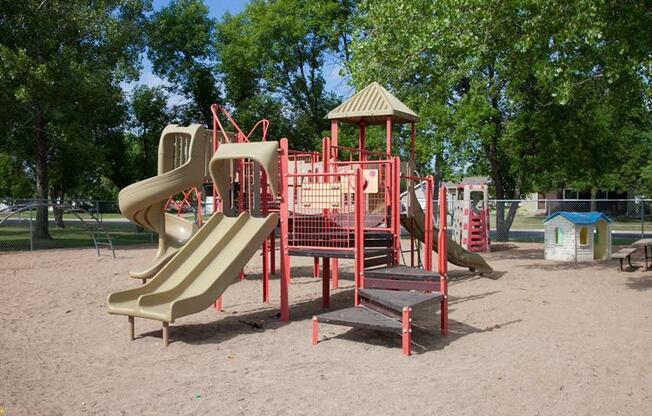 Playground with several slides and a gazebo at Parkwest Gardens West Fargo, ND 58078 