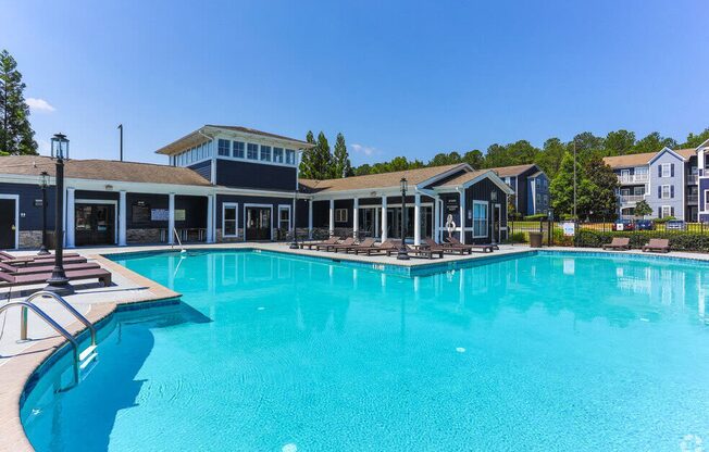 a large pool with a building in the background