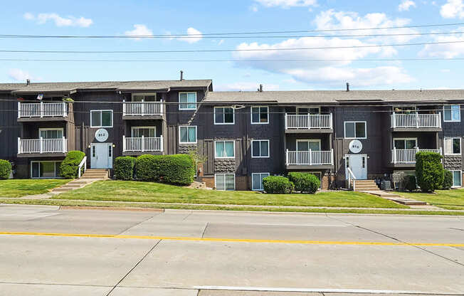 Apartment building with a clear blue sky above.