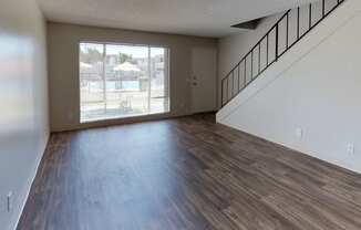Living room with view of stairs leading upstairs