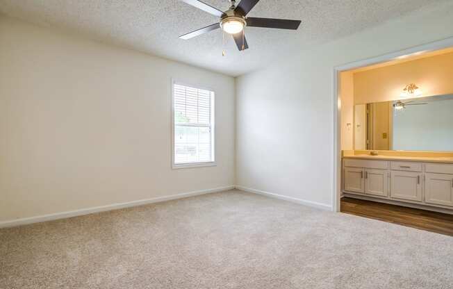 bedroom with ceiling fan and carpeted flooring