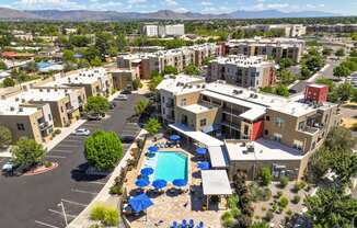 an aerial view of apartment buildings and a swimming pool
