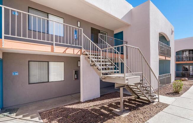 A building with a staircase leading to the second floor.