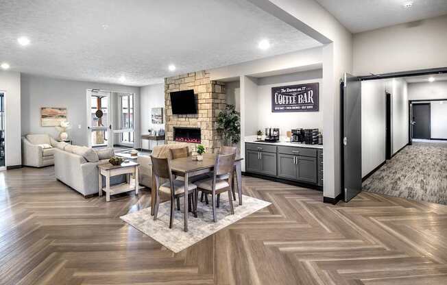 A modern living room with a coffee bar and a fireplace.