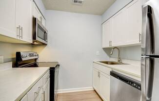 Apartment Home Kitchen at Fernwood Grove Apartments at 4900 MacDill Ave in Tampa, Florida