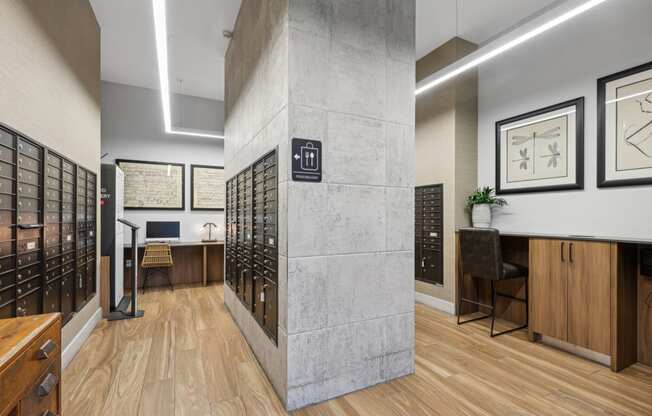 Indoor mail room close to the lobby area with computer center and food delivery pods at Bay Village 1 in Palmetto Bay, FL