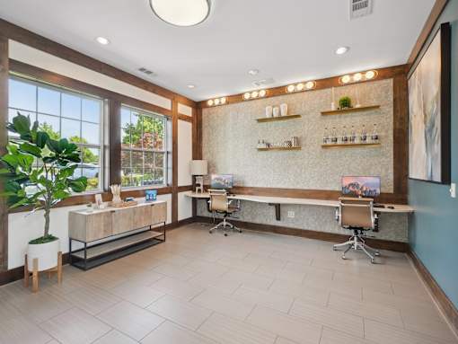 Resident business center and coworking lounge at Village at Broadstone Station apartments in Apex, NC