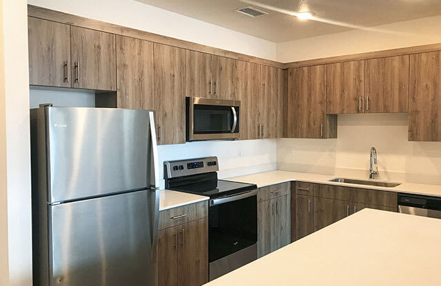 Fully Equipped Kitchen With Modern Appliances at Foothill Lofts Apartments & Townhomes, Logan, Utah