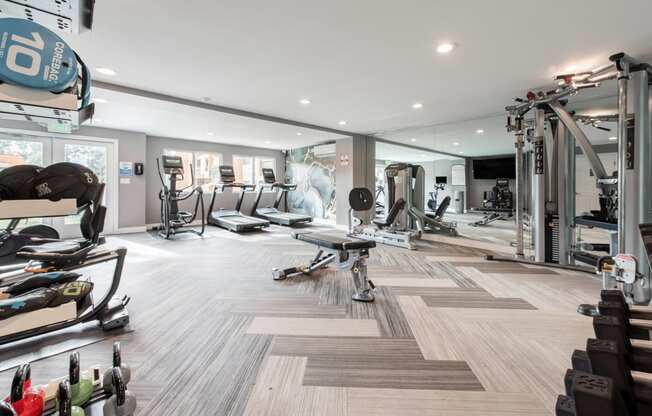 Wide shot of fitness center with cardio and strength equipment