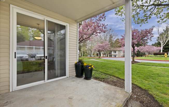 the view from the front porch of a home with a glass door