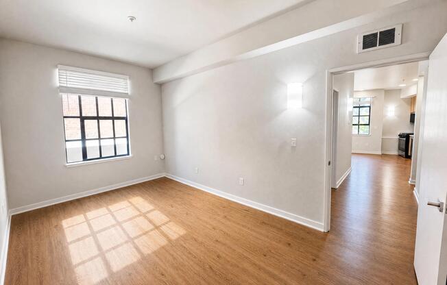Redesigned bedroom with updated lighting and an oversized window.