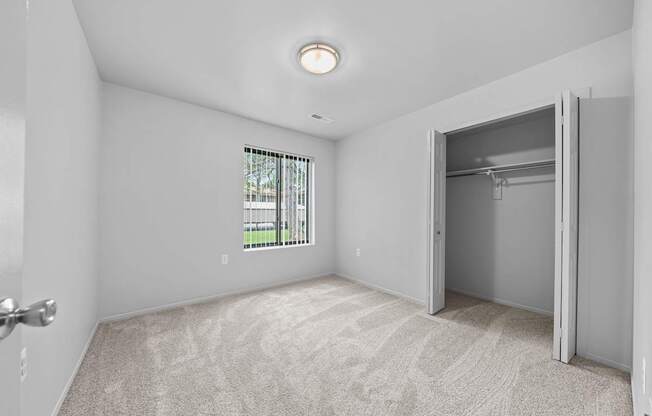 Big bedroom with natural lighting at Westwood Village Apartments in Westland, MI