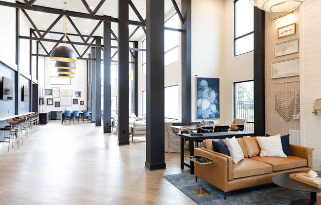 A large room with a couch and a table.