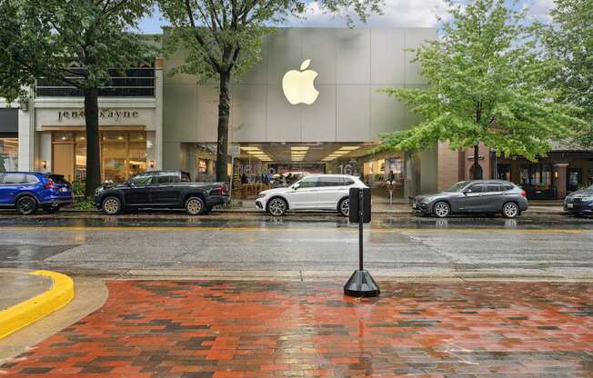 A parking lot in front of an Apple store.