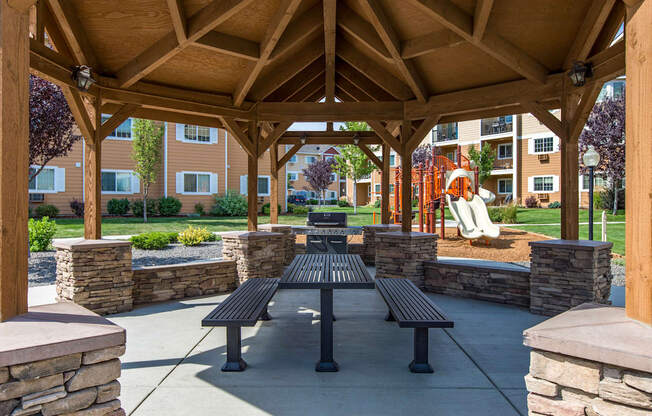 an open pavilion with benches and a picnic table  at Quail Springs, Washington, 99353