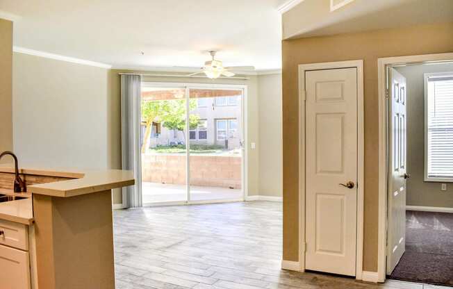 view from entry of unit looking out patio and bedroom