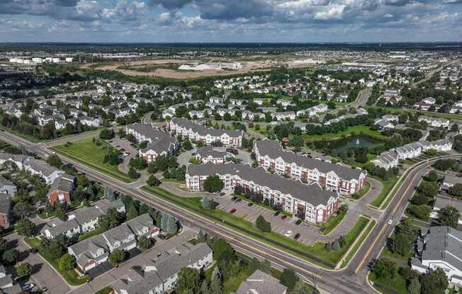 A suburban area with a mix of residential and commercial buildings.