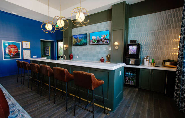 a bar with chairs and a counter in a room with a tv