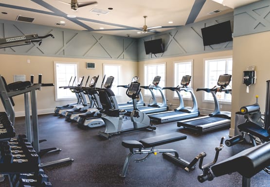 Fitness center with cardio equipment; flat screen TV