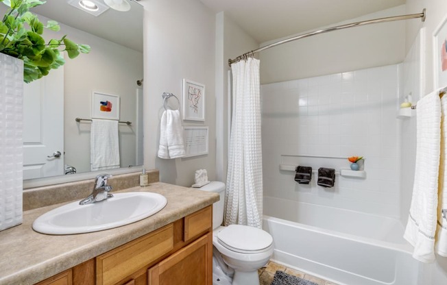 a bathroom with a bathtub toilet and sink